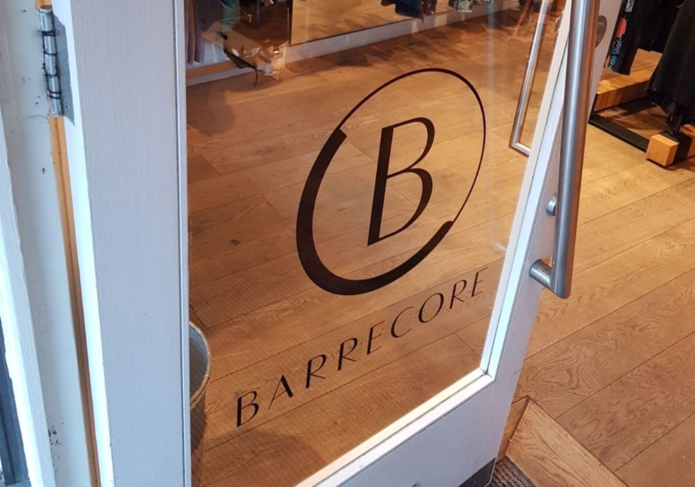 Branded vinyls on Barecore glass door