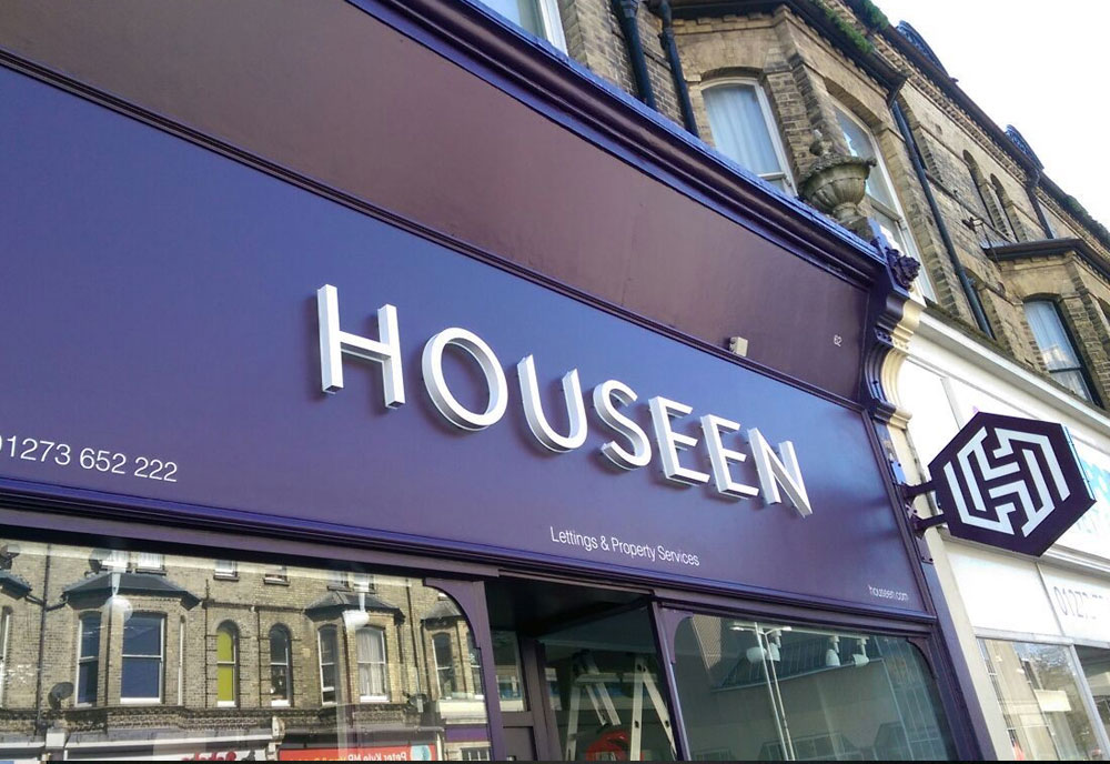 Housseen Estate Agents sign